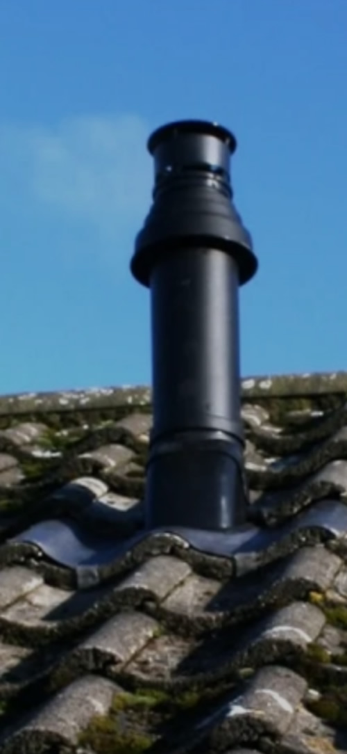 Vertical flue emerging from the loft space