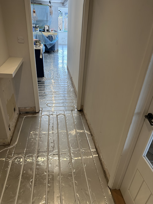Underfloor heating being fitted in a Ferndown property